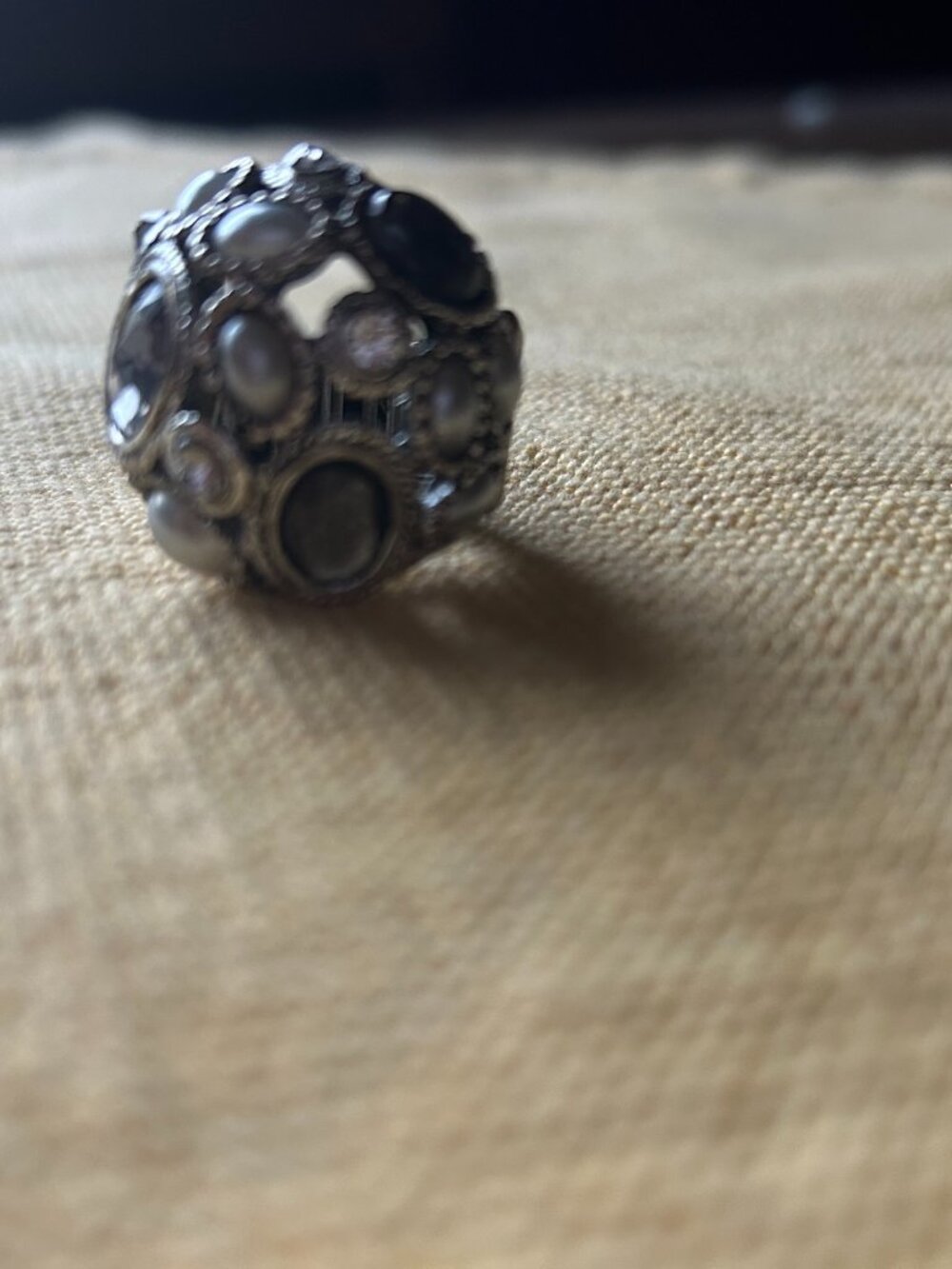 Vintage style sliver-tone dome cocktail ring featuring an intricate cluster of